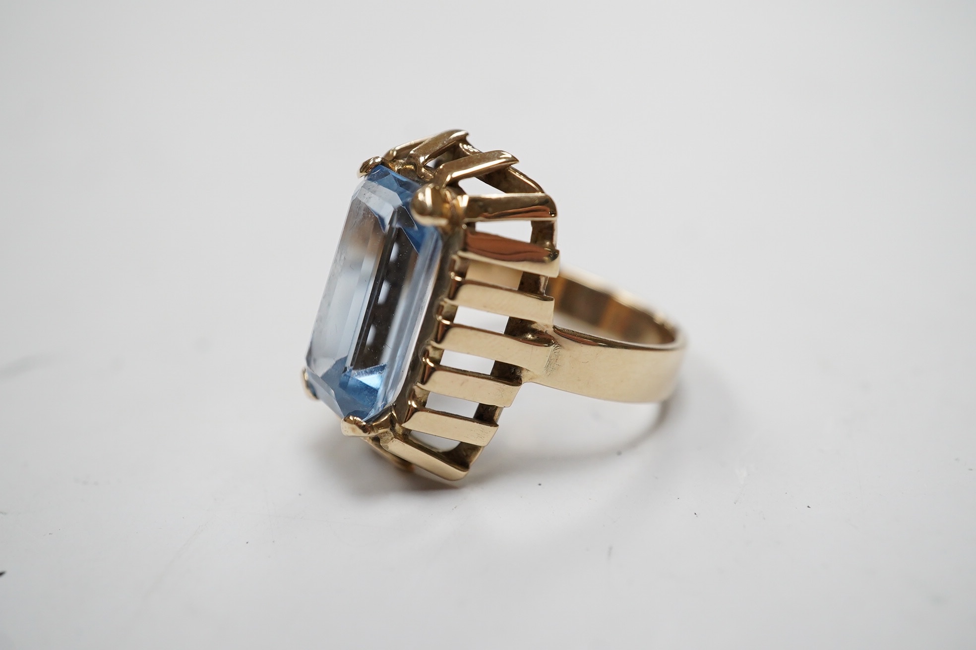 An 8ct yellow metal and single stone synthetic blue spinel set dress ring, size P, gross weight 7.3 grams, Condition - fair to good.